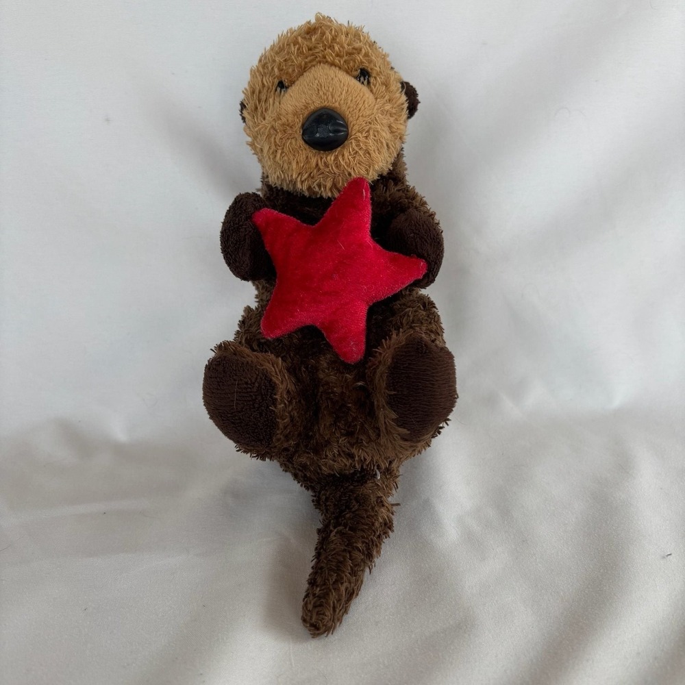 Aurora Plush Sea Otter Holding Red Starfish Stuffed Animal